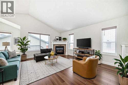 226 Saddlebrook Circle Ne, Calgary, AB - Indoor Photo Showing Living Room With Fireplace