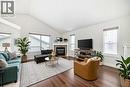 226 Saddlebrook Circle Ne, Calgary, AB  - Indoor Photo Showing Living Room With Fireplace 