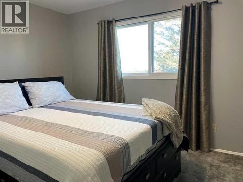 #2-Bedroom - Primary only room with carpet - 4516 45 Street, Rycroft, AB - Indoor Photo Showing Bedroom