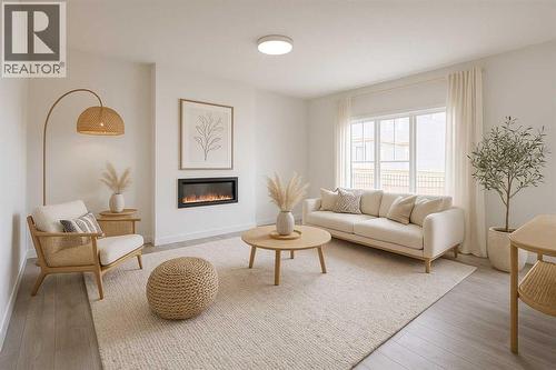 63 Amber View, Balzac, AB - Indoor Photo Showing Living Room With Fireplace