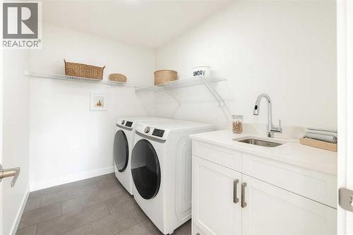 14 Quartz Gate, Balzac, AB - Indoor Photo Showing Laundry Room
