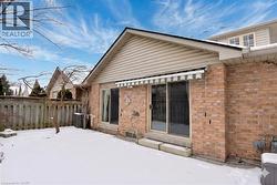Retractable Awning in the landscaped fenced yard - 