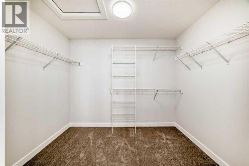 100 Corner Glen Manor Ne, Calgary, AB - Indoor With Storage
