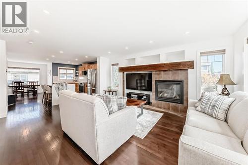 182 Sunset Heights, Cochrane, AB - Indoor Photo Showing Living Room With Fireplace