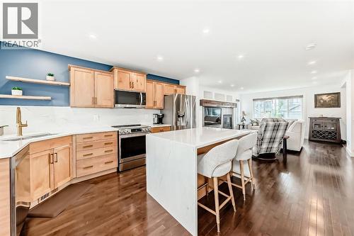 182 Sunset Heights, Cochrane, AB - Indoor Photo Showing Kitchen With Upgraded Kitchen