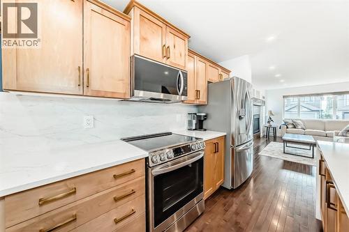 182 Sunset Heights, Cochrane, AB - Indoor Photo Showing Kitchen