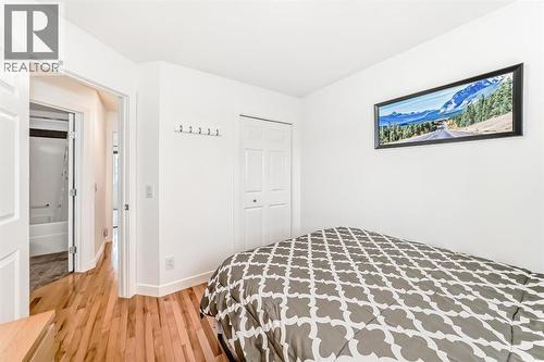 182 Sunset Heights, Cochrane, AB - Indoor Photo Showing Bedroom