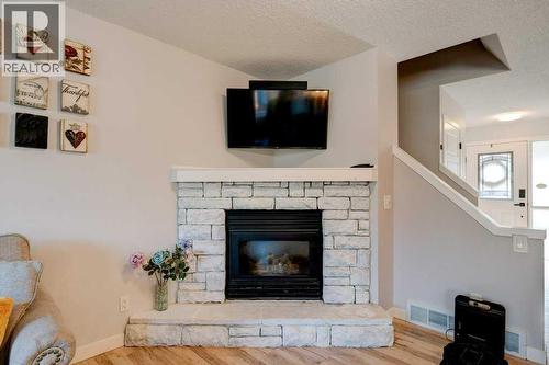 15 Chaparral Crescent Se, Calgary, AB - Indoor Photo Showing Living Room With Fireplace