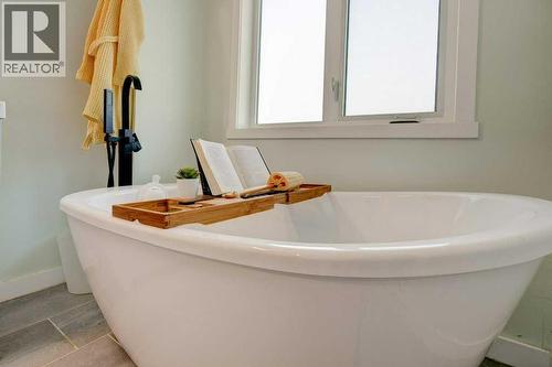 Deep soaker tub - 15 Chaparral Crescent Se, Calgary, AB - Indoor Photo Showing Bathroom