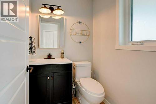 Main floor 1/2 bath - 15 Chaparral Crescent Se, Calgary, AB - Indoor Photo Showing Bathroom