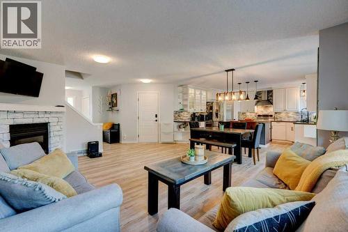 Extra large family room - 15 Chaparral Crescent Se, Calgary, AB - Indoor Photo Showing Living Room With Fireplace