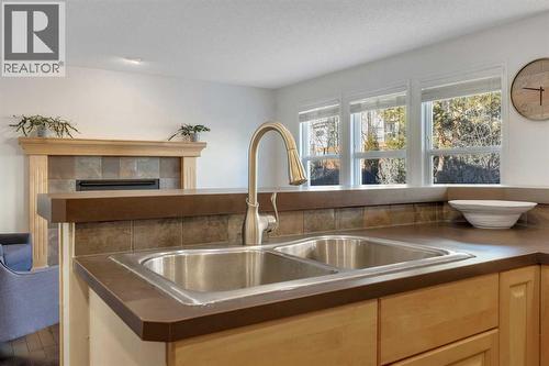 29 Sunset Close, Cochrane, AB - Indoor Photo Showing Kitchen With Double Sink