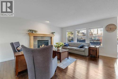 29 Sunset Close, Cochrane, AB - Indoor Photo Showing Living Room With Fireplace