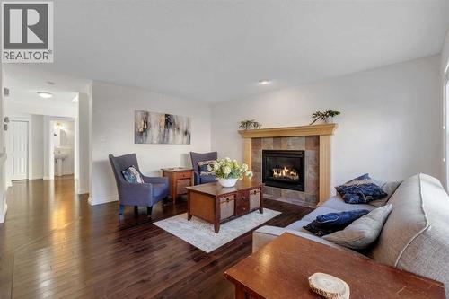29 Sunset Close, Cochrane, AB - Indoor Photo Showing Living Room With Fireplace