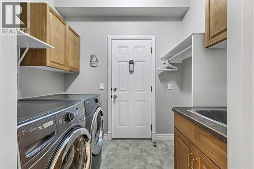 69 Evergreen Crescent Sw, Calgary, AB - Indoor Photo Showing Laundry Room