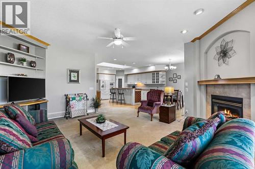 69 Evergreen Crescent Sw, Calgary, AB - Indoor Photo Showing Living Room With Fireplace