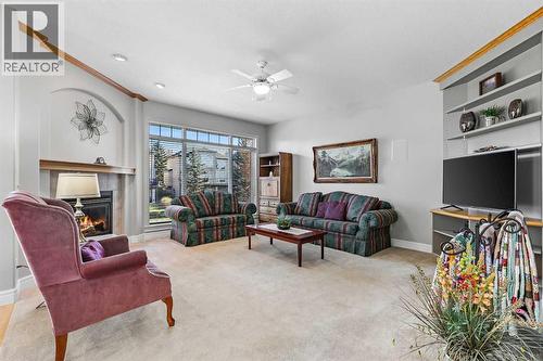 69 Evergreen Crescent Sw, Calgary, AB - Indoor Photo Showing Living Room With Fireplace