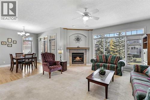 69 Evergreen Crescent Sw, Calgary, AB - Indoor Photo Showing Living Room With Fireplace