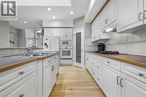 69 Evergreen Crescent Sw, Calgary, AB - Indoor Photo Showing Kitchen With Double Sink