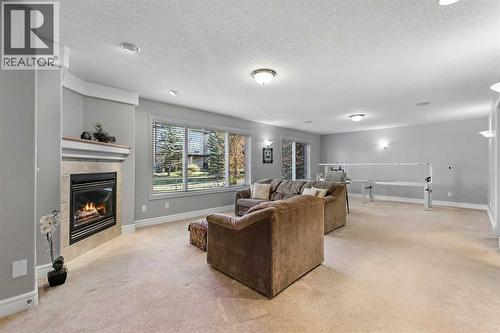 69 Evergreen Crescent Sw, Calgary, AB - Indoor With Fireplace