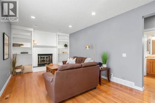 16 Woodacres Drive Sw, Calgary, AB - Indoor Photo Showing Living Room With Fireplace