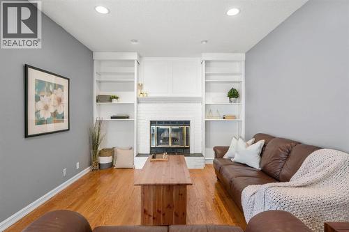 16 Woodacres Drive Sw, Calgary, AB - Indoor Photo Showing Living Room With Fireplace