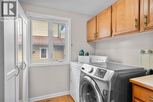 16 Woodacres Drive Sw, Calgary, AB - Indoor Photo Showing Laundry Room