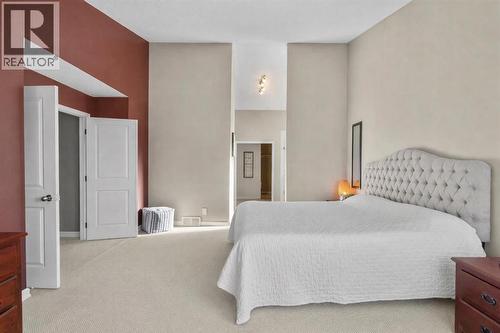16 Woodacres Drive Sw, Calgary, AB - Indoor Photo Showing Bedroom