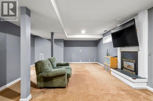16 Woodacres Drive Sw, Calgary, AB - Indoor With Fireplace