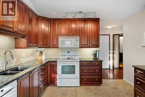 63 Douglas Park Boulevard Se, Calgary, AB - Indoor Photo Showing Kitchen With Double Sink