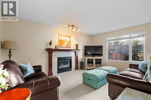 63 Douglas Park Boulevard Se, Calgary, AB - Indoor Photo Showing Living Room With Fireplace