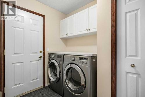 63 Douglas Park Boulevard Se, Calgary, AB - Indoor Photo Showing Laundry Room