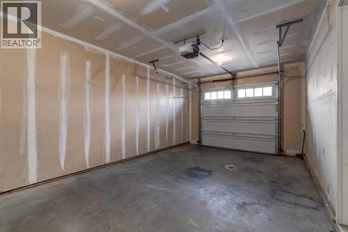 705 Evanston Square Nw, Calgary, AB - Indoor Photo Showing Garage