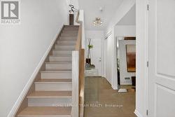 Foyer with entry to garage & den - 