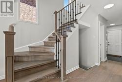 Custom Oak Staircase Elegant Iron Picket Railings - 