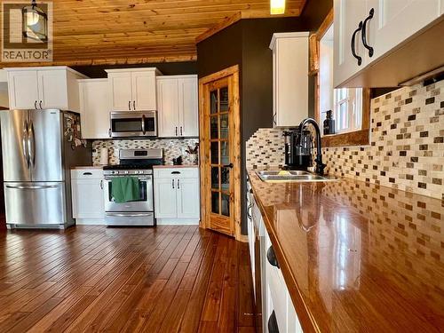 107 Poplar Avenue, Trochu, AB - Indoor Photo Showing Kitchen With Stainless Steel Kitchen With Double Sink