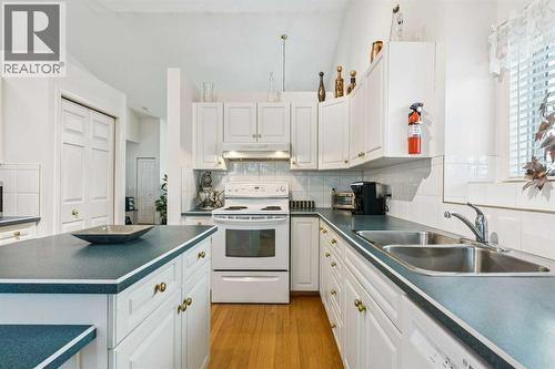 312 Prominence Heights Sw, Calgary, AB - Indoor Photo Showing Kitchen With Double Sink