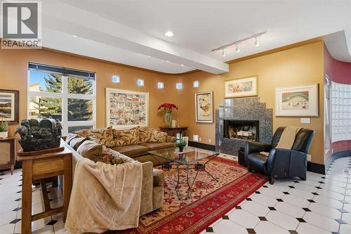 64 Patterson Mews Sw, Calgary, AB - Indoor Photo Showing Living Room With Fireplace