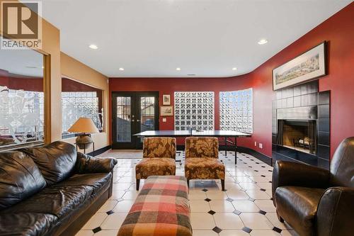 64 Patterson Mews Sw, Calgary, AB - Indoor Photo Showing Living Room With Fireplace