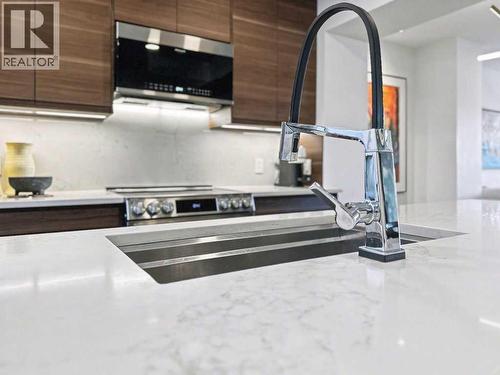 14 Aspen Hills Terrace Sw, Calgary, AB - Indoor Photo Showing Kitchen With Double Sink