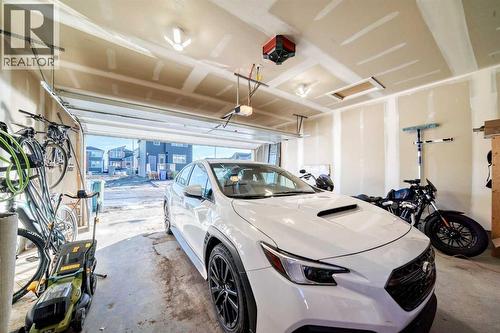 115 Wolf Hollow Park Se, Calgary, AB - Indoor Photo Showing Garage
