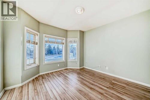 Primary bedroom - 205, 7 Lineham Avenue, Okotoks, AB - Indoor Photo Showing Other Room