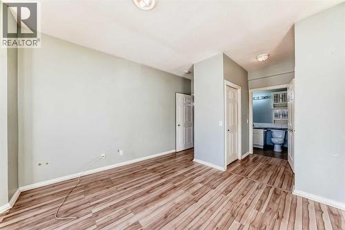 Primary bedroom - 205, 7 Lineham Avenue, Okotoks, AB - Indoor Photo Showing Other Room