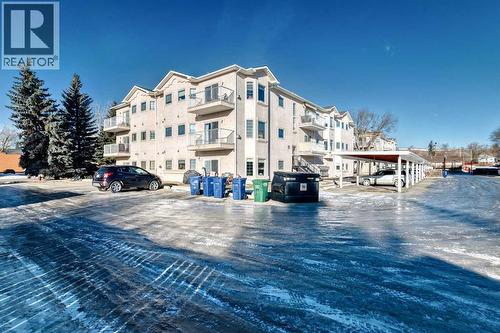 205, 7 Lineham Avenue, Okotoks, AB - Outdoor With Facade