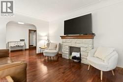 Beautiful cove ceilings, decortive fireplace with wood beam mantel - 