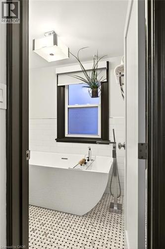 Stand alone tub with handheld shower fixtures - 17 Gary Avenue, Hamilton, ON - Indoor Photo Showing Bathroom
