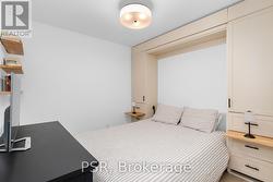 Den w/ queen murphy bed w/ sidetable & storage - 