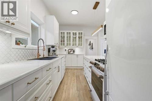 Kitchen - 712 5 Street Nw, Calgary, AB - Indoor Photo Showing Kitchen With Double Sink With Upgraded Kitchen