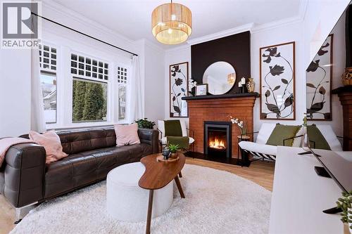 Living Room - 712 5 Street Nw, Calgary, AB - Indoor Photo Showing Living Room With Fireplace