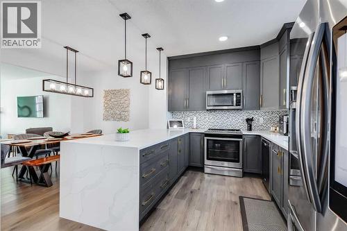 117 Highview Gate Se, Airdrie, AB - Indoor Photo Showing Kitchen With Upgraded Kitchen